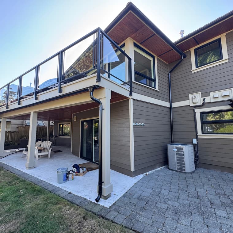 Deck underside, soffits and siding painted on a modern home