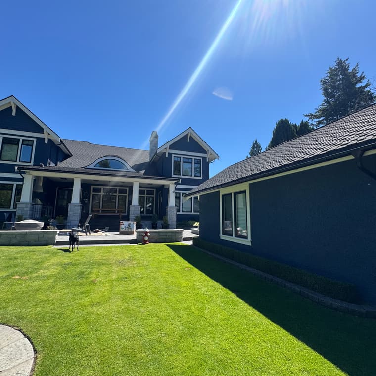 Navy blue two-storey home exterior painting